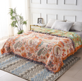 Full flat lay of the boho floral throw blanket showing the complete tapestry pattern and fringe border